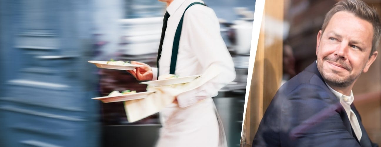 Serveur Horeca en mouvement et représentant d’une fédération observant depuis une fenêtre